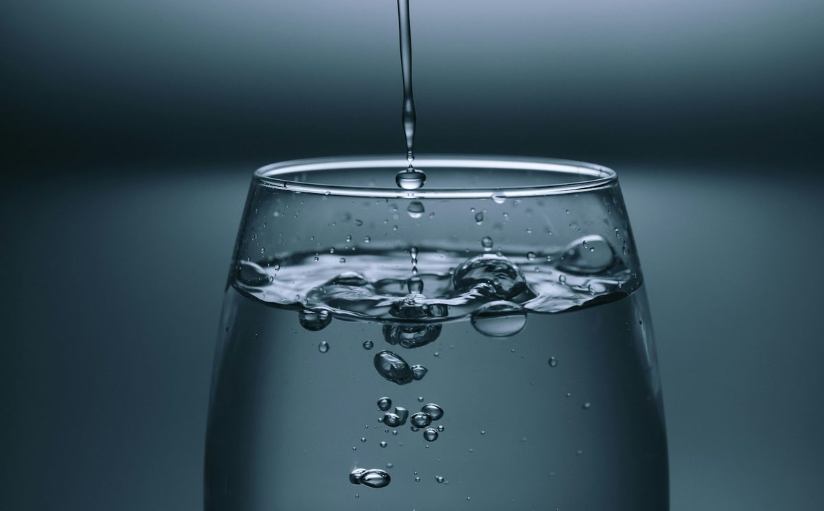 Clear water pouring into a glass